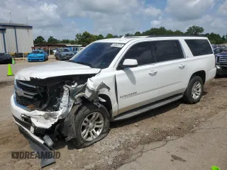 2015 Chevrolet Suburban LT with VIN 1GNSKJKC9FR616632, listed as a Copart auction lot 62652375 with 157,846 mi miles and Salvage title. Bid and sale history available at DreamBid. Image 1.