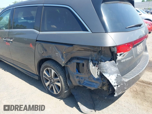 2014 Honda Odyssey Touring with VIN 5FNRL5H90EB082691, listed as a IAAI auction lot 42572977 with 54,413 mi miles and . Bid and sale history available at DreamBid. Image 6.