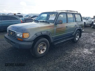 1995 Toyota Land Cruiser z VIN JT3DJ81W0S0094999, wystawiony jako IAAI lot #41583748 z przebiegiem 93 454 mil mil oraz . Historia ofert i sprzedaży dostępna na DreamBid. Obrazek 2.