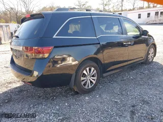 2016 Honda Odyssey EX-L with VIN 5FNRL5H63GB050617, listed as a IAAI auction lot 41678167 with 128,000 mi miles. Bid and sale history available at carsss.com. Image 4.