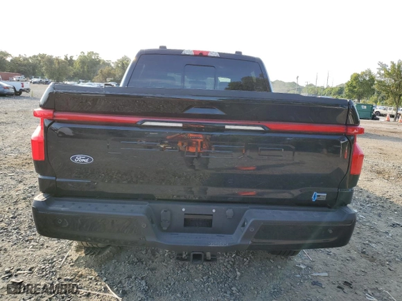 2024 Ford F-150 Lightning LARIAT with VIN 1FT6W5L73RWG03162, listed as a Copart auction lot 71613234 with 1,651 mi miles and Salvage Title. Bid and sale history available at carsss.com. Image 6.