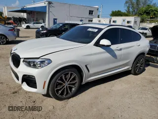 2021 BMW X4 xDrive30i with VIN 5UX2V1C0XM9E11002, listed as a Copart auction lot 67348653 with 27,805 mi miles. Bid and sale history available at carsss.com. Image 1.