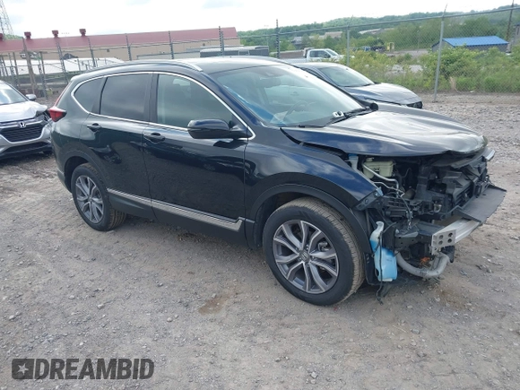 2021 Honda CR-V Touring with VIN 5J6RW2H92ML003064, listed as a IAAI auction lot 42298361 with 70,988 mi miles and . Bid and sale history available at DreamBid. Image 1.