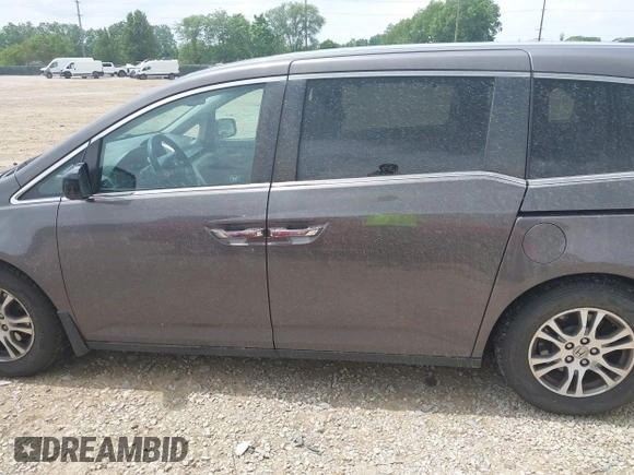 2012 Honda Odyssey EX-L with VIN 5FNRL5H60CB054277, listed as a IAAI auction lot 42459861 with 205,722 mi miles and . Bid and sale history available at DreamBid. Image 14.
