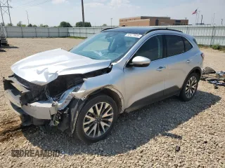 2020 Ford Escape Titanium with VIN 1FMCU9J98LUA78182, listed as a Copart auction lot 60477635 with 76,117 mi miles and Salvage title. Bid and sale history available at DreamBid. Image 1.