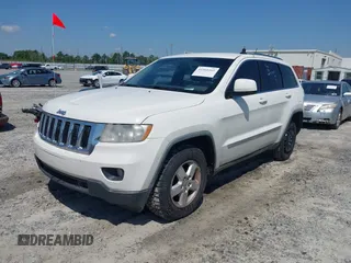 2011 Jeep Grand Cherokee Laredo with VIN 1J4RS4GG5BC573337, listed as a IAAI auction lot 41960369 with 185,518 mi miles and . Bid and sale history available at DreamBid. Image 2.