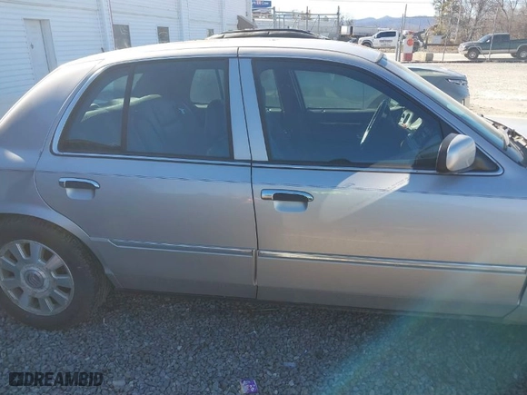 2005 Mercury Grand Marquis LS Premium with VIN 2MEFM75W05X636896, listed as a IAAI auction lot 41636318 with 182,257 mi miles. Bid and sale history available at carsss.com. Image 13.