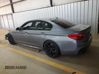 2018 BMW 5 Series M550i xDrive with VIN WBAJB9C55JB050213, listed as a Copart auction lot 61714255 with 34,700 mi miles and Salvage title. Bid and sale history available at DreamBid. Image 2.
