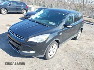 2013 Ford Escape SEL with VIN 1FMCU9HX5DUC58726, listed as a IAAI auction lot 41766493 with 219,093 mi miles. Bid and sale history available at carsss.com. Image 2.