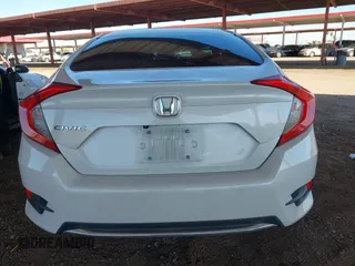 2020 Honda Civic LX with VIN 19XFC2F66LE007328, listed as a IAAI auction lot 41852111 with 135,956 mi miles and . Bid and sale history available at DreamBid. Image 16.