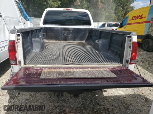 2000 Ford Super Duty F-250 XL with VIN 1FTNF20F9YEC91357, listed as a Copart auction lot 76673234 with 318,306 mi miles and Salvage Title. Bid and sale history available at carsss.com. Image 6.