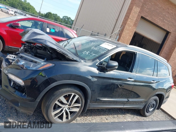 2017 Honda Pilot Touring with VIN 5FNYF5H91HB038268, listed as a IAAI auction lot 42786448 with 62,195 mi miles and . Bid and sale history available at DreamBid. Image 15.