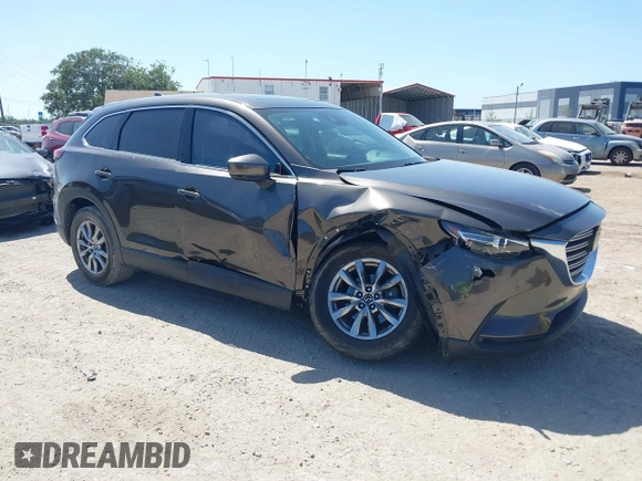 2019 Mazda CX-9 Touring with VIN JM3TCACY9K0304899, listed as a IAAI auction lot 42167180 with 57,043 mi miles and . Bid and sale history available at DreamBid. Image 1.