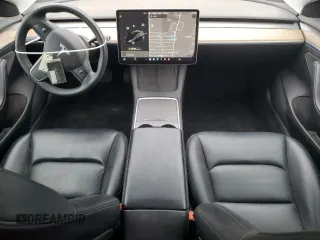 2021 Tesla Model 3 Standard Range Plus with VIN 5YJ3E1EA2MF087879, listed as a Copart auction lot 51853235 with 65,477 mi miles and Non Repairable. Bid and sale history available at carsss.com. Image 8.