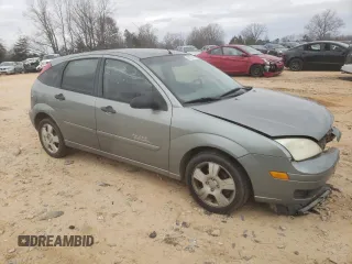2006 Ford Focus S with VIN 1FAHP37N76W180039, listed as a Copart auction lot 58328565 with 220,696 mi miles and Salvage title. Bid and sale history available at DreamBid. Image 4.