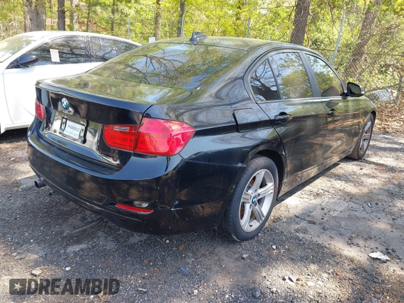 2014 BMW 3 Series 320i with VIN WBA3B1C56EK131849, listed as a IAAI auction lot 42018005 with 215,765 mi miles. Bid and sale history available at carsss.com. Image 4.