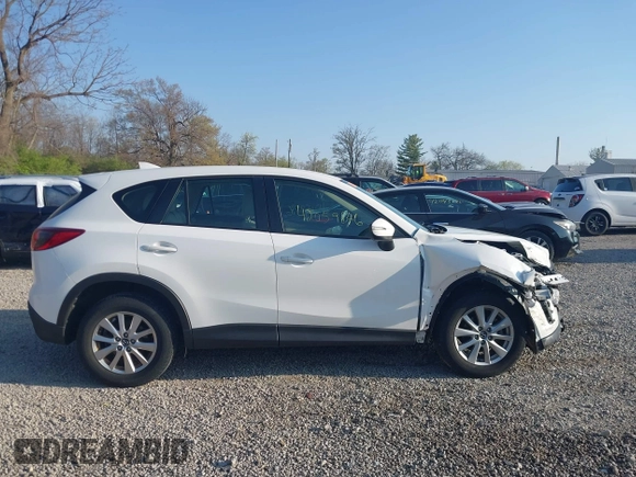 2016 Mazda CX-5 Sport with VIN JM3KE2BY2G0819604, listed as a IAAI auction lot 42059846 with 124,911 mi miles. Bid and sale history available at carsss.com. Image 13.