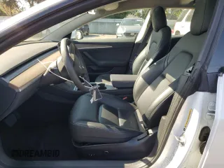 2023 Tesla Model 3 with VIN 5YJ3E1EA7PF450343, listed as a Copart auction lot 52446595 with 36,137 mi miles and Salvage Title. Bid and sale history available at DreamBid. Image 7.