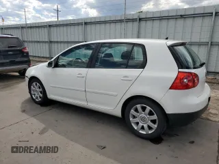 2009 Volkswagen Rabbit S with VIN WVWDB71K79W085935, listed as a Copart auction lot 60697594 with 102,780 mi miles and Salvage title. Bid and sale history available at DreamBid. Image 2.