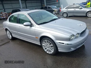 2003 Jaguar X-Type 2.5L Manual with VIN SAJEA51D33XC93300, listed as a IAAI auction lot 42048118 with 116,939 mi miles and . Bid and sale history available at DreamBid. Image 1.