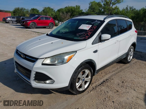 2013 Ford Escape SE with VIN 1FMCU0GX1DUB71466, listed as a IAAI auction lot 42329136 with 103,763 mi miles and . Bid and sale history available at DreamBid. Image 2.