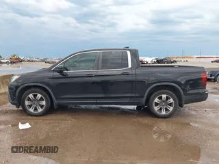 2017 Honda Ridgeline RTL-T with VIN 5FPYK2F64HB003542, listed as a IAAI auction lot 42171243 with 102,071 mi miles and . Bid and sale history available at DreamBid. Image 14.