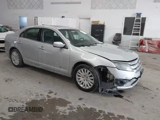 2010 Ford Fusion Hybrid z VIN 3FADP0L39AR146567, wystawiony jako IAAI lot #41610631 z przebiegiem 185 829 mil mil oraz . Historia ofert i sprzedaży dostępna na DreamBid. Obrazek 1.