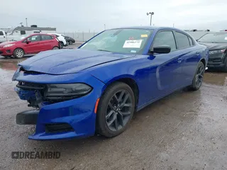 2019 Dodge Charger SXT with VIN 2C3CDXBGXKH748729, listed as a IAAI auction lot 41906272 with 76,816 mi miles. Bid and sale history available at carsss.com. Image 2.