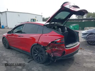 2022 Tesla Model X Plaid with VIN 7SAXCBE60NF330246, listed as a IAAI auction lot 41477394 with 51,612 mi miles and . Bid and sale history available at carsss.com. Image 3.