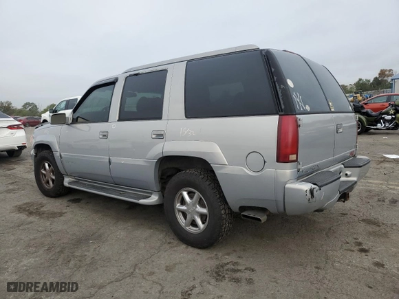 2000 GMC Denali with VIN 1GKEK13RXYR110436, listed as a Copart auction lot 74311244 with 250,735 mi miles and Salvage Title. Bid and sale history available at carsss.com. Image 2.