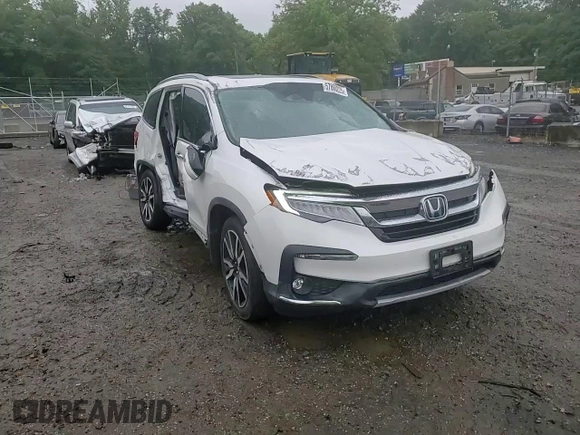 2021 Honda Pilot Touring 7-Passenger z VIN 5FNYF6H64MB004962, wystawiony jako Copart lot #57860225 z przebiegiem 52 311 mil mil oraz Szkoda całkowita • Salvage title. Historia ofert i sprzedaży dostępna na DreamBid. Obrazek 14.