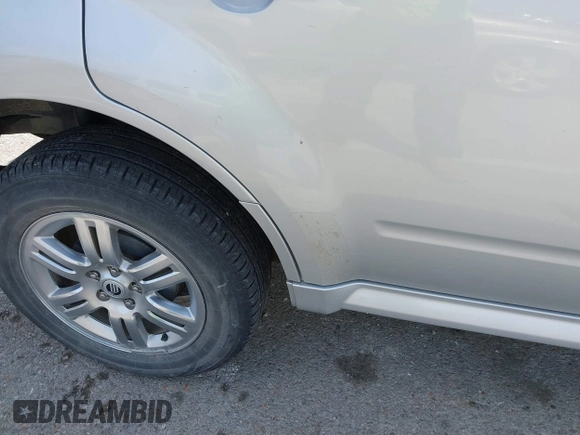 2008 Mercury Mariner Premier with VIN 4M2CU97198KJ12620, listed as a IAAI auction lot 41909389 with 131,884 mi miles and . Bid and sale history available at DreamBid. Image 12.