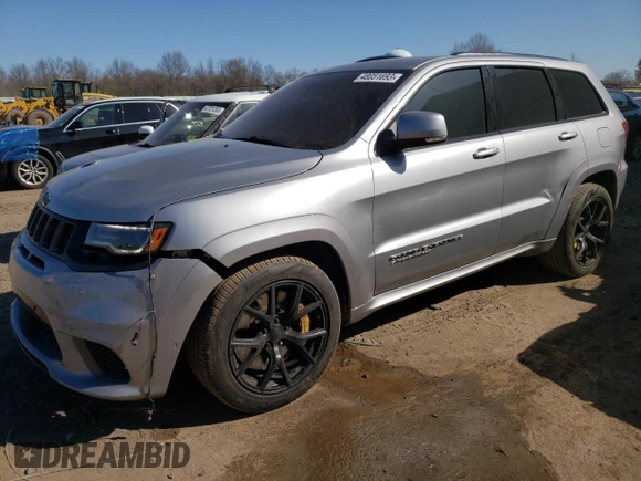 2018 Jeep Grand Cherokee with VIN NJ1454E, listed as a Copart auction lot 48051693 with 66,894 mi miles and Salvage title. Bid and sale history available at DreamBid. Image 1.