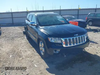2013 Jeep Grand Cherokee Overland with VIN 1C4RJFCT1DC654653, listed as a IAAI auction lot 41826619 with 124,283 mi miles. Bid and sale history available at carsss.com. Image 1.