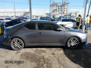 2016 Scion tC with VIN JTKJF5C78GJ014184, listed as a IAAI auction lot 41622575 with 128,520 mi miles. Bid and sale history available at carsss.com. Image 13.