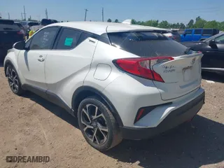 2019 Toyota C-HR XLE with VIN JTNKHMBX7K1023674, listed as a IAAI auction lot 42021152 with 106,450 mi miles. Bid and sale history available at carsss.com. Image 3.