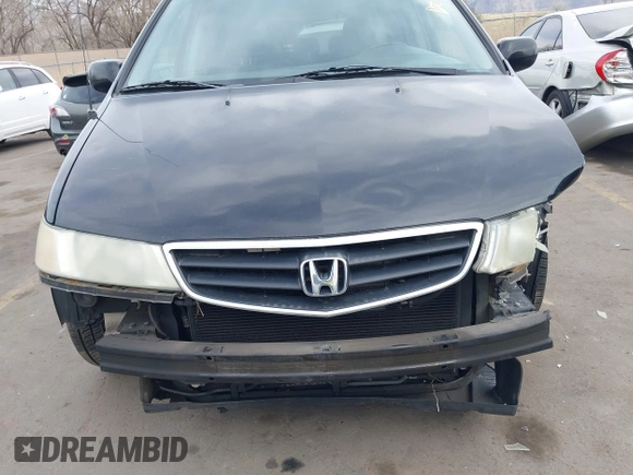 2004 Honda Odyssey EX-L with VIN 5FNRL18914B037976, listed as a IAAI auction lot 41893438 with Not Provided miles and . Bid and sale history available at DreamBid. Image 6.