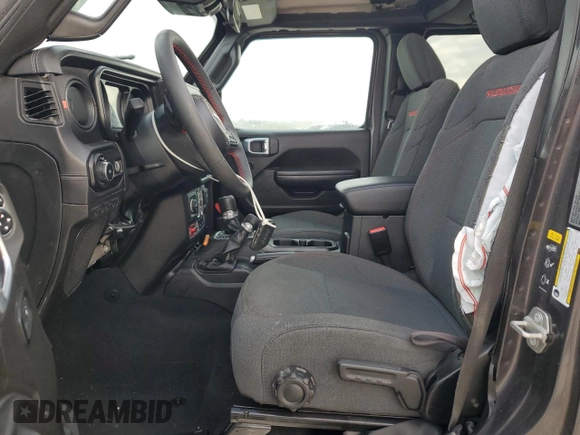 2024 Jeep Wrangler Rubicon z VIN 1C4PJXFG6RW261748, wystawiony jako Copart lot #51479585 z przebiegiem 7 911 mil mil oraz Szkoda całkowita • Salvage title. Historia ofert i sprzedaży dostępna na DreamBid. Obrazek 7.