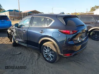 2021 Mazda CX-5 Grand Touring Reserve with VIN JM3KFBAYXM0465762, listed as a IAAI auction lot 40728368 with 30,667 mi miles. Bid and sale history available at carsss.com. Image 3.