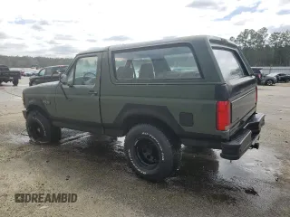 1992 Ford Bronco XL with VIN 1FMEU15N2NLA71562, listed as a Copart auction lot 48827285 with 198,042 mi miles and Salvage Title. Bid and sale history available at carsss.com. Image 2.