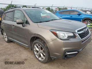2017 Subaru Forester Touring z VIN JF2SJAWC6HH529707, wystawiony jako IAAI lot #42401138 z przebiegiem 172 868 mil mil oraz . Historia ofert i sprzedaży dostępna na DreamBid. Obrazek 1.