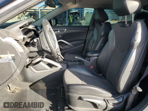 2013 Hyundai Veloster w/Black Int z VIN KMHTC6AD0DU135773, wystawiony jako Copart lot #41367875 z przebiegiem 96 487 mil mil oraz Szkoda całkowita • Salvage title. Historia ofert i sprzedaży dostępna na DreamBid. Obrazek 7.