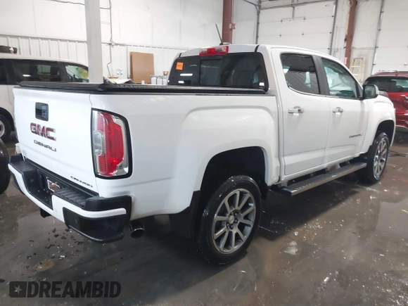 2021 GMC Canyon 4WD Denali with VIN 1GTG6EEN0M1229180, listed as a IAAI auction lot 41298304 with 55,865 mi miles. Bid and sale history available at carsss.com. Image 4.