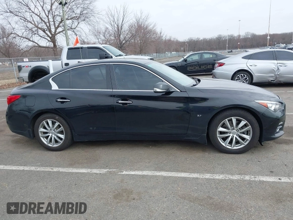 2015 Infiniti Q50 z VIN JN1BV7AR6FM412573, wystawiony jako IAAI lot #41796802 z przebiegiem 136 410 mil mil oraz . Historia ofert i sprzedaży dostępna na DreamBid. Obrazek 13.