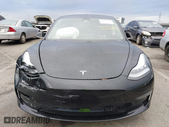 2019 Tesla Model 3 Mid Range with VIN 5YJ3E1EA6KF361808, listed as a IAAI auction lot 41767241 with 96,200 mi miles and . Bid and sale history available at carsss.com. Image 12.
