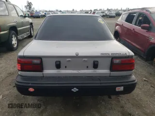 1992 Toyota Corolla z VIN 1NXAE91A1NZ346555, wystawiony jako Copart lot #37697334 z przebiegiem 232 988 mil mil oraz Szkoda całkowita • Salvage title. Historia ofert i sprzedaży dostępna na DreamBid. Obrazek 6.