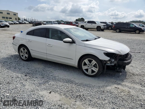 2014 Volkswagen CC R-Line with VIN WVWBP7AN4EE525757, listed as a Copart auction lot 55293795 with 124,890 mi miles and Salvage title. Bid and sale history available at DreamBid. Image 4.