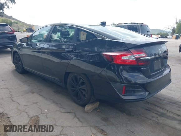 2018 Honda Clarity Plug-In Hybrid with VIN JHMZC5F10JC014054, listed as a IAAI auction lot 41932195 with 100,643 mi miles. Bid and sale history available at carsss.com. Image 3.