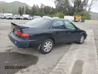 2000 Toyota Camry LE z VIN 4T1BF22K9YU949936, wystawiony jako Copart lot #54782815 z przebiegiem 239 139 mil mil oraz Szkoda całkowita • Salvage title. Historia ofert i sprzedaży dostępna na DreamBid. Obrazek 3.
