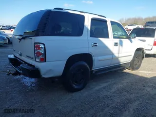 2004 Chevrolet Tahoe LT with VIN 1GNEC13Z54R112847, listed as a IAAI auction lot 41633571 with 234,991 mi miles. Bid and sale history available at carsss.com. Image 4.